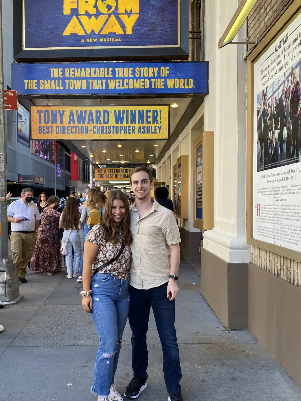 Leah and Justin under the Come From Away marquee on Broadway.